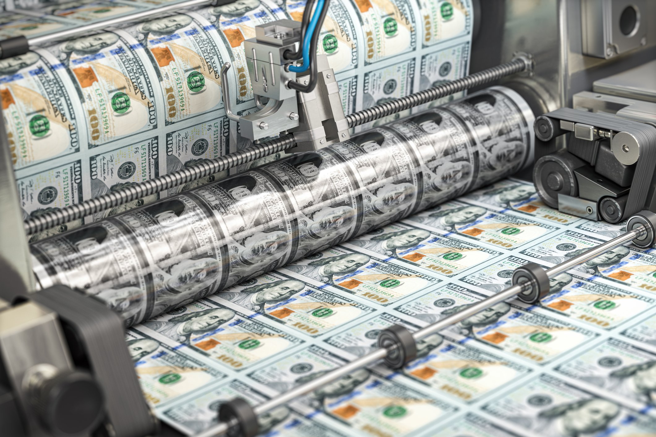photo of a money printer printing out seven rows of 100 bills