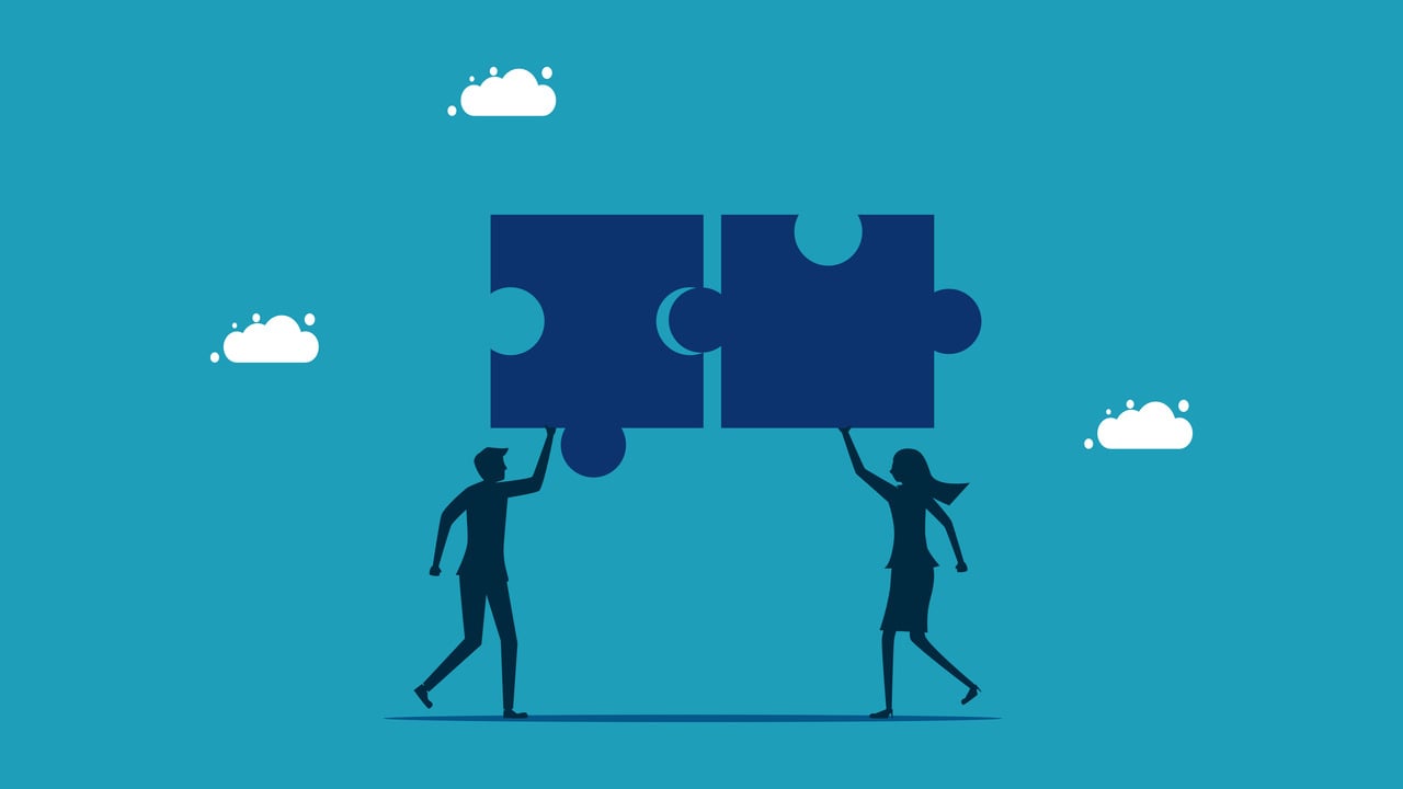 illustration of two people putting puzzle pieces together merger and acquisition concept