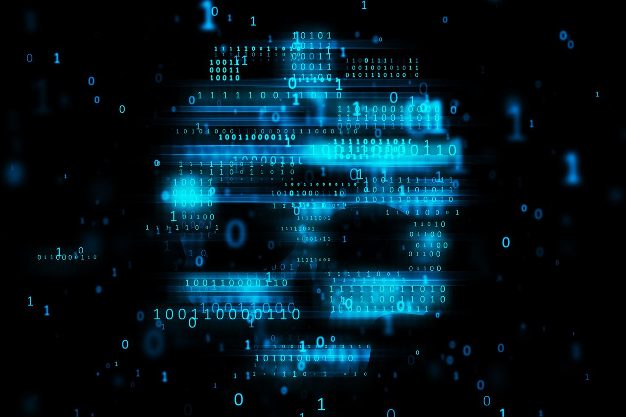 hacking concept with blurred blue binary code in form of skull symbol on dark background