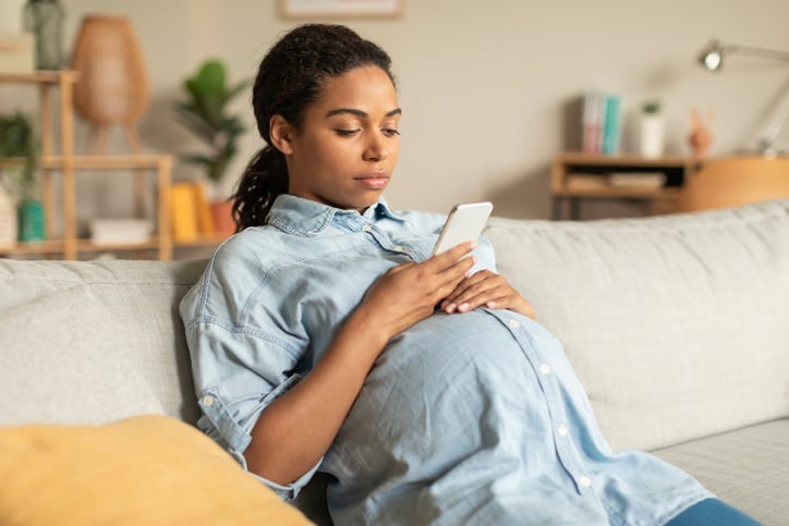 pregnant woman on phone