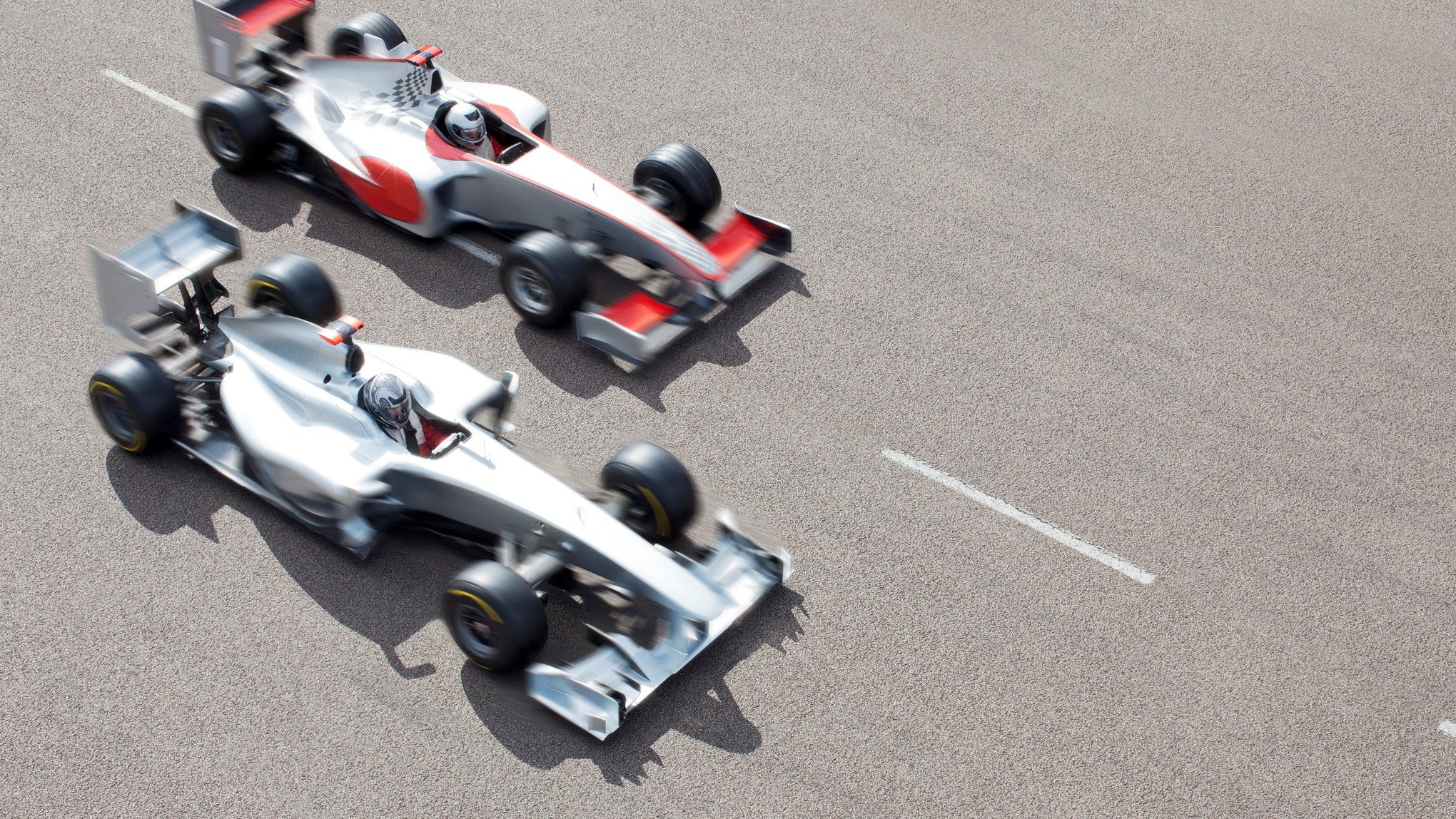 image of two race cars neck and neck