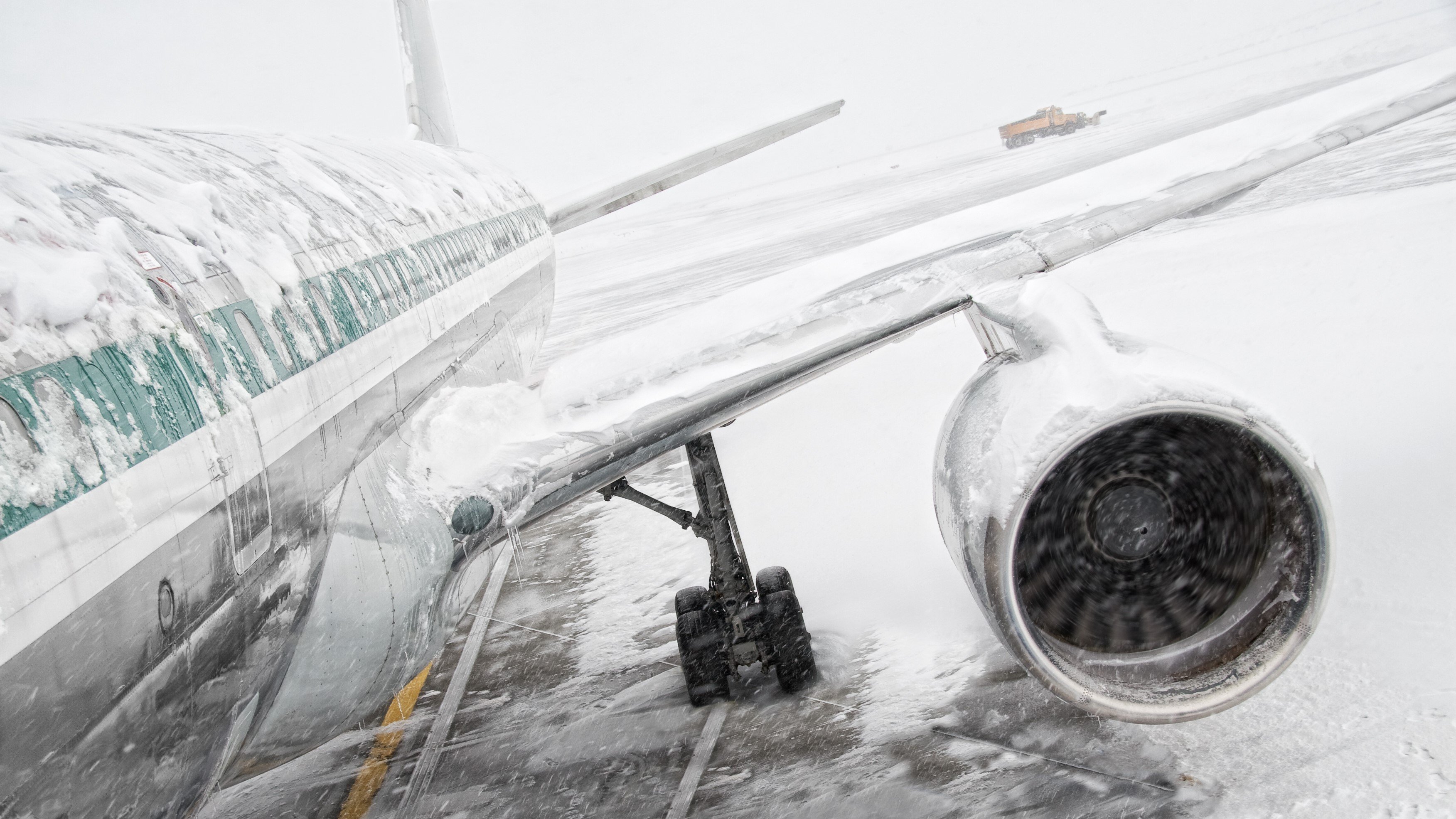 snowy plane snow storm airplane airport stall frozen