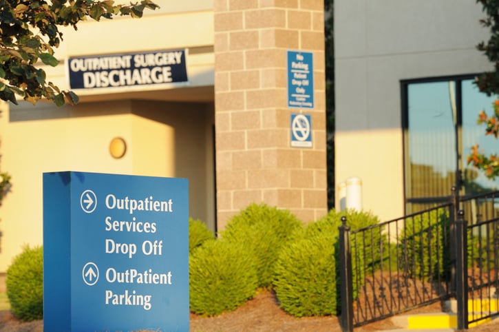 A sign directing patients to outpatient parking