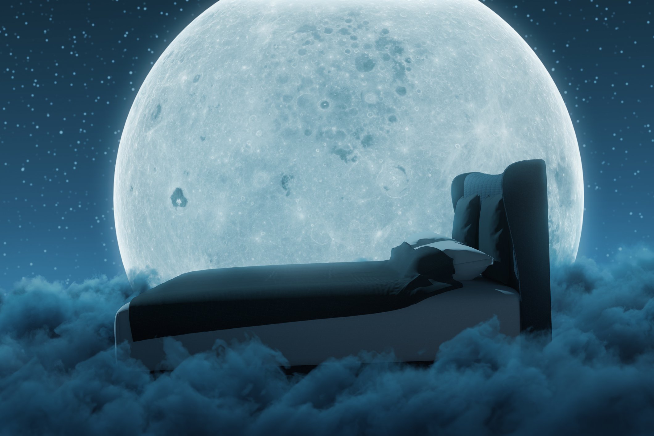 Bed floating on a cloud with the full moon behind it