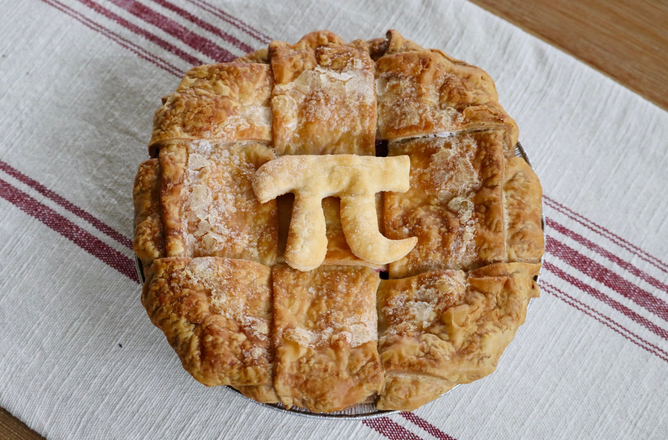 A pie decorated with pi