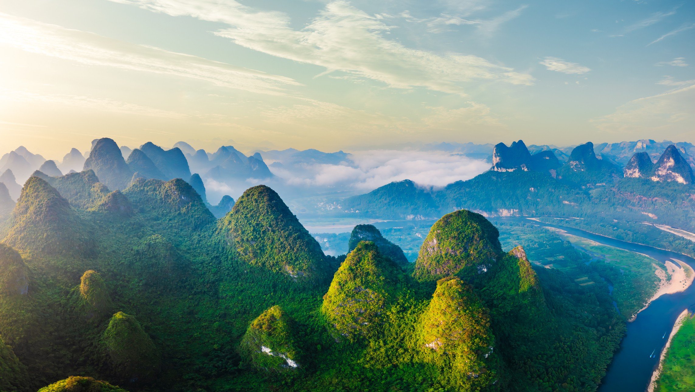 Aerial view of karst mountains and sky clouds natural landscape at sunrise in Guilin China