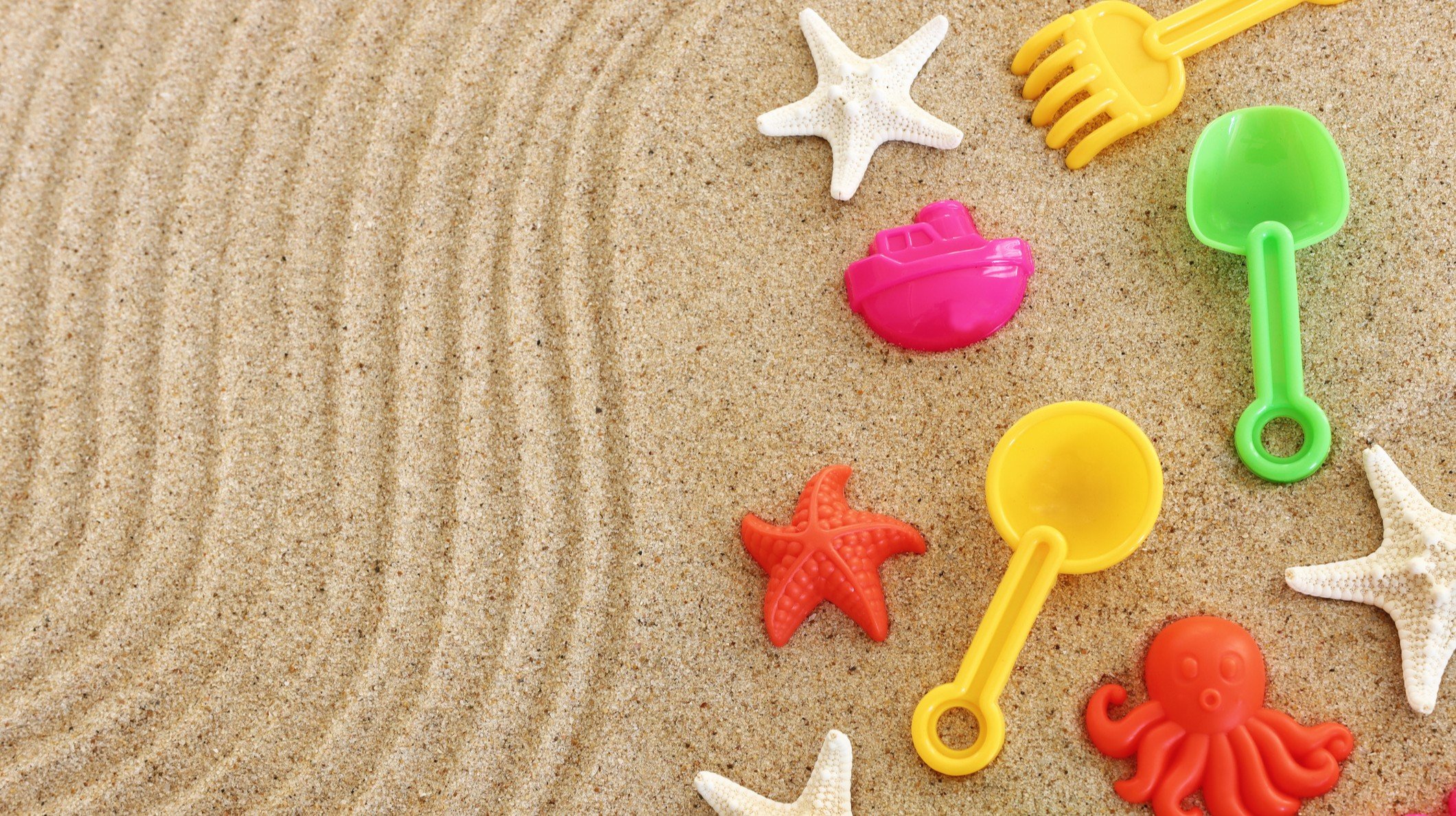 sand with colorful childrens toys