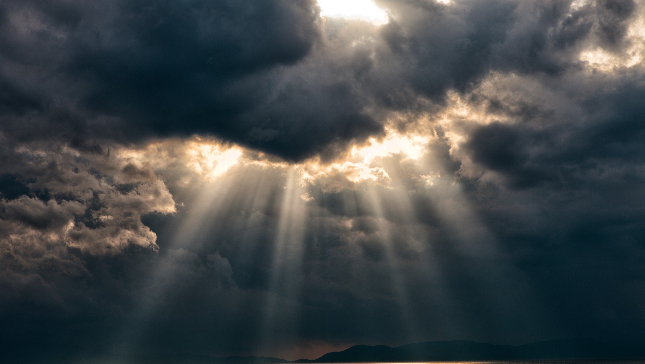Dark and dramatic sky with sunlight