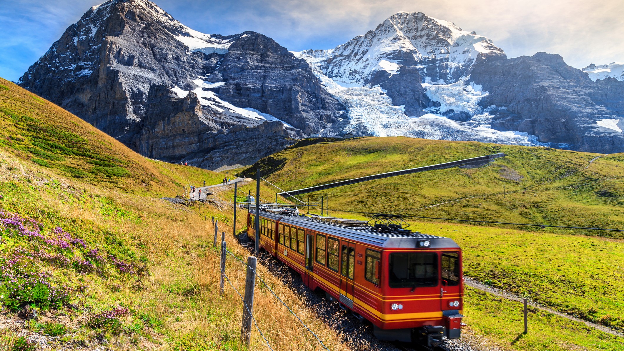Photo of a train heading toward the Eiger mountain peaks 