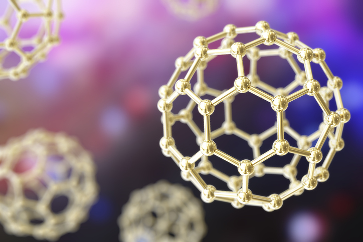 An artists concept of a nanoparticle shown in gold against a background with bright shades of purple and pink