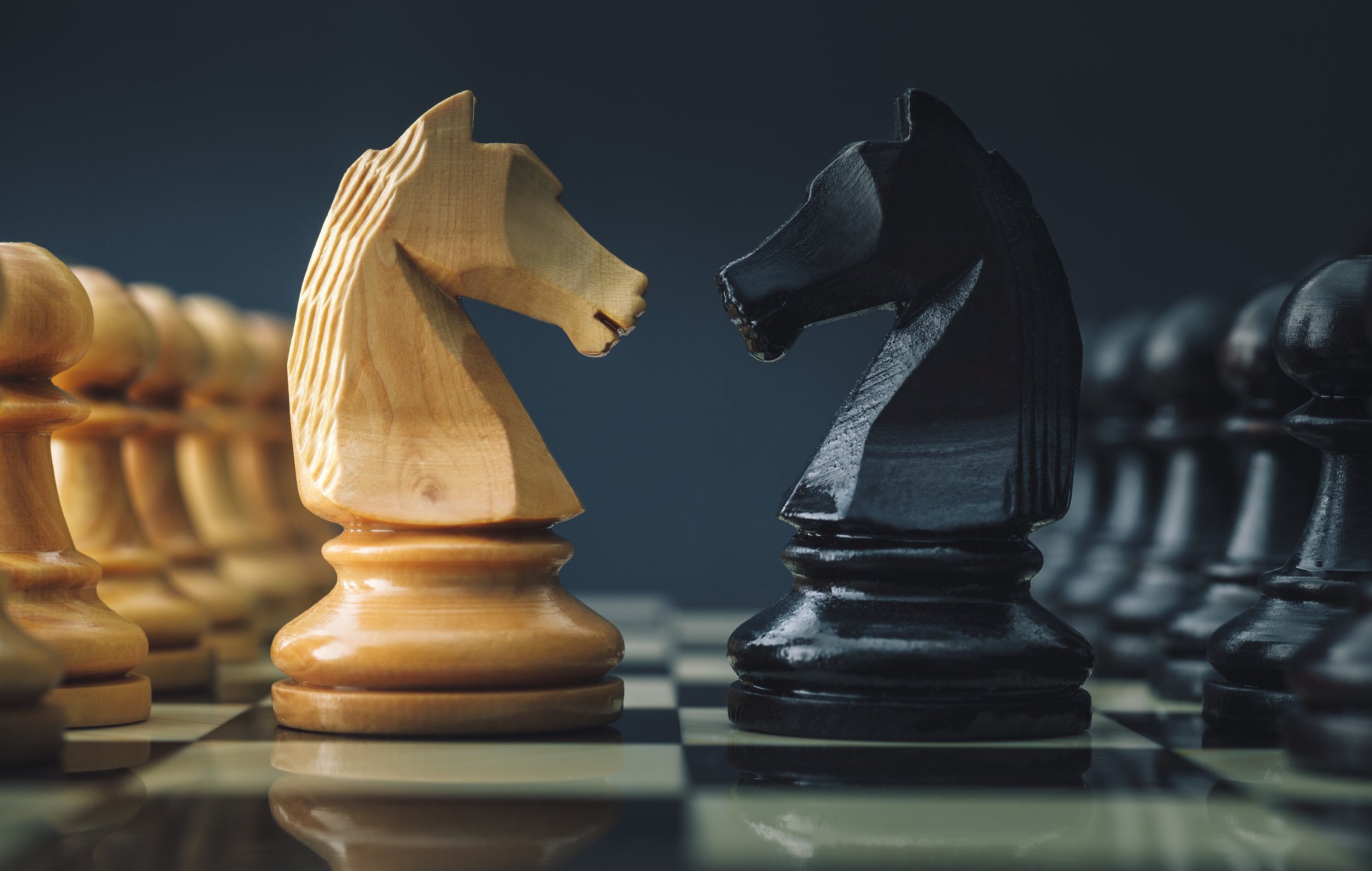 Images of two chess pieces right in front of each other
