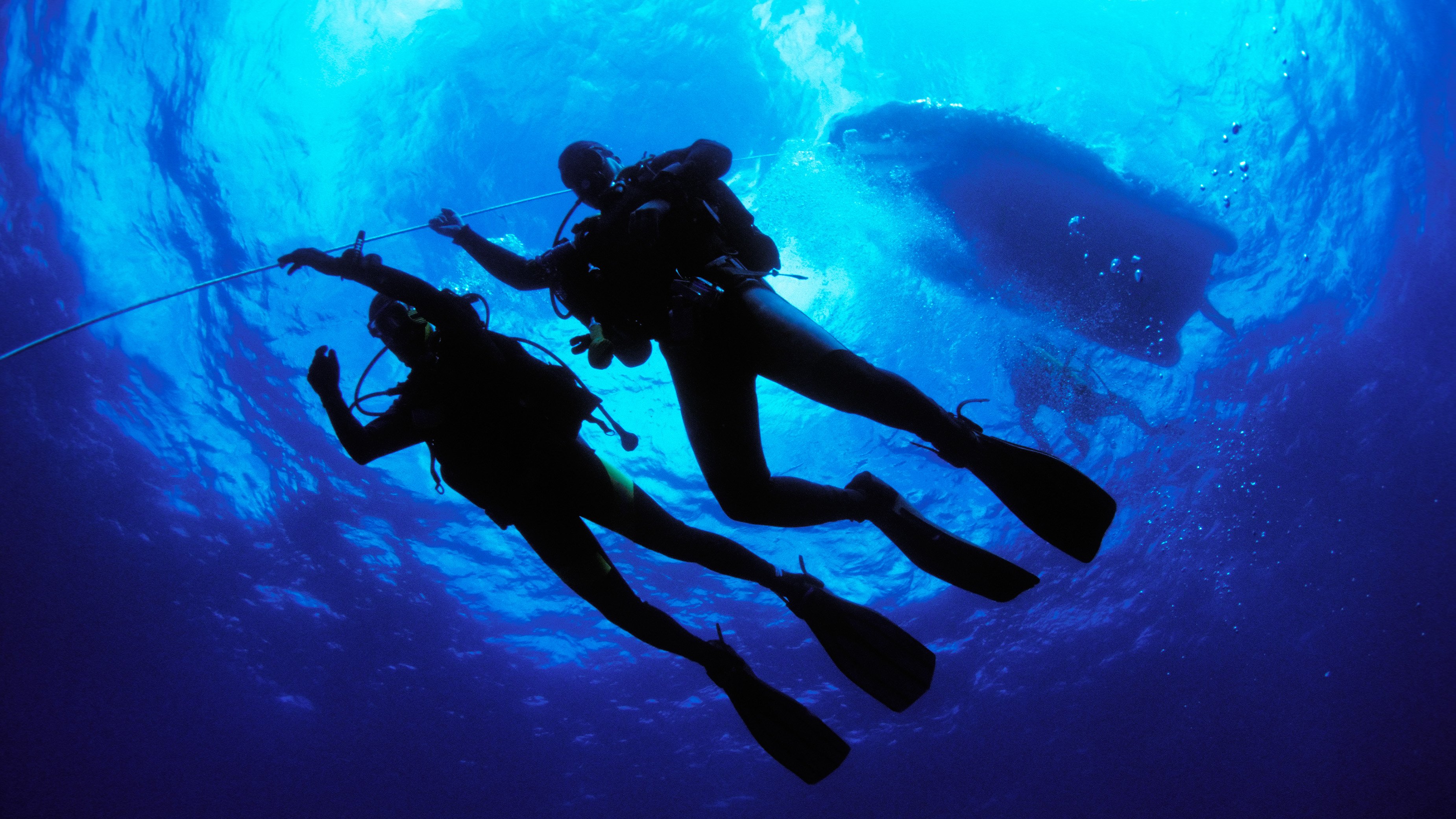 deep dive scuba diving swimming water blue ocean boat