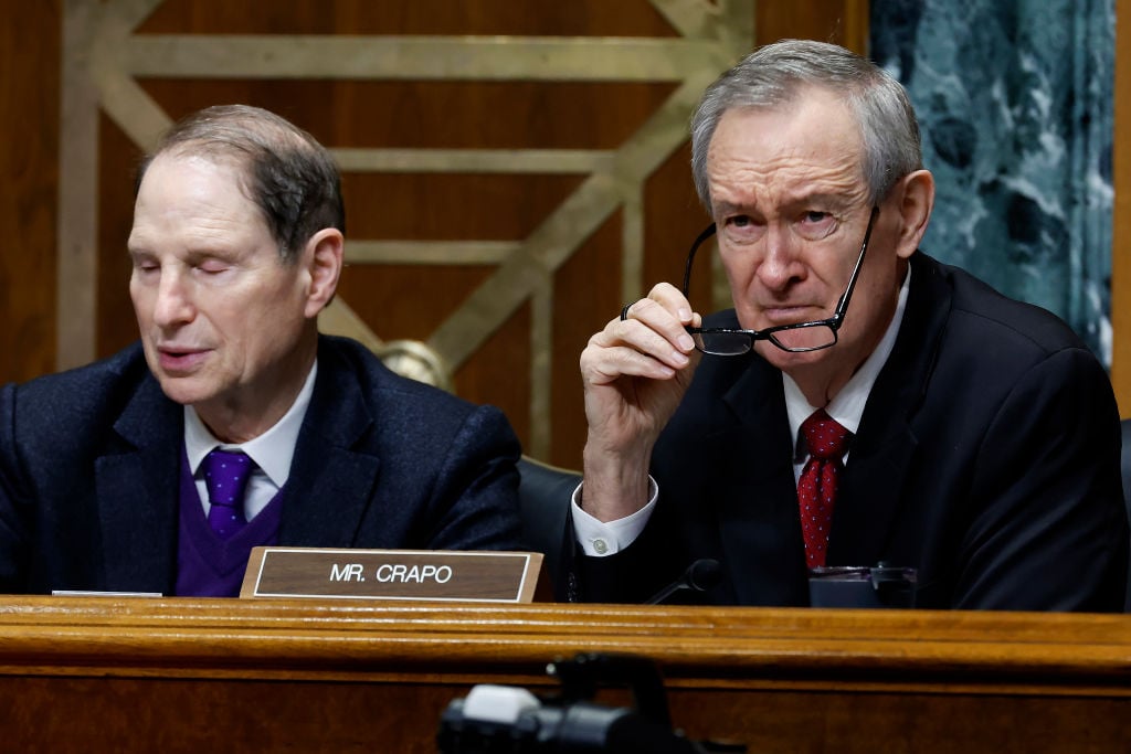 Mike Crapo right listens during a Senate Finance Committee hearing March 16 2023