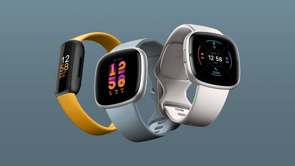 Three Fitbit smartwatches