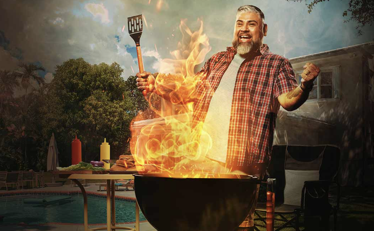 A photo from the Kyzatrex website showing a man stood at a BBQ grill