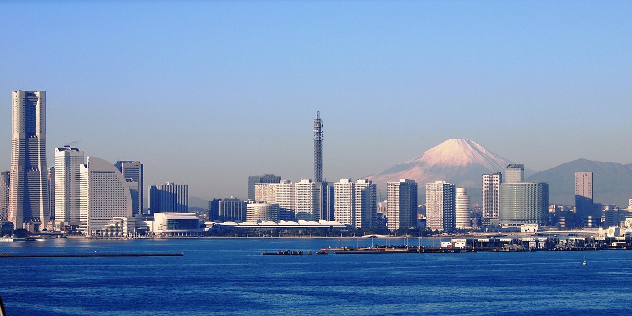 Yokohama city skyline with ocean in the foreground and Mount Fuji in the background