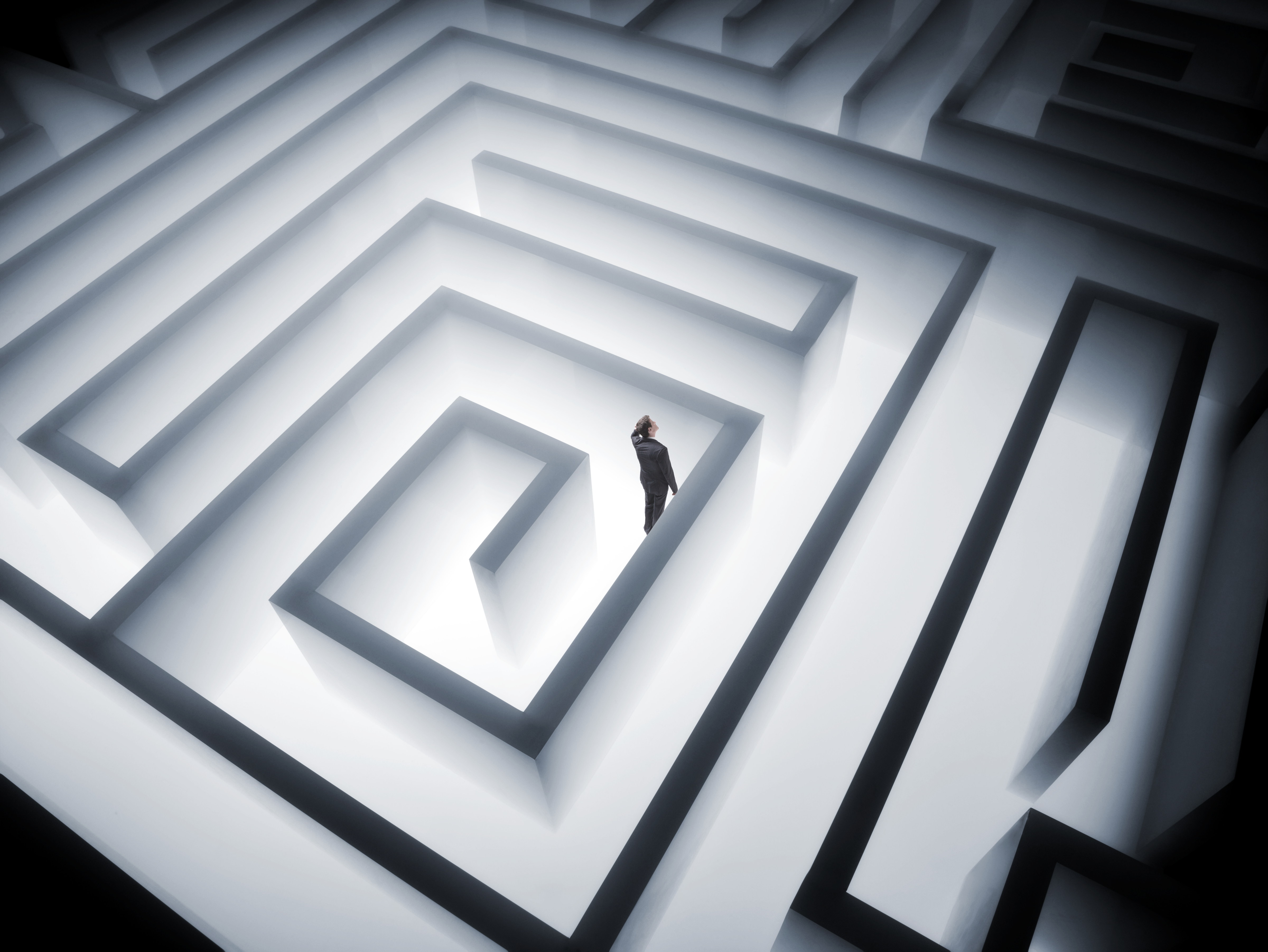 A man trying to find his way through a maze
