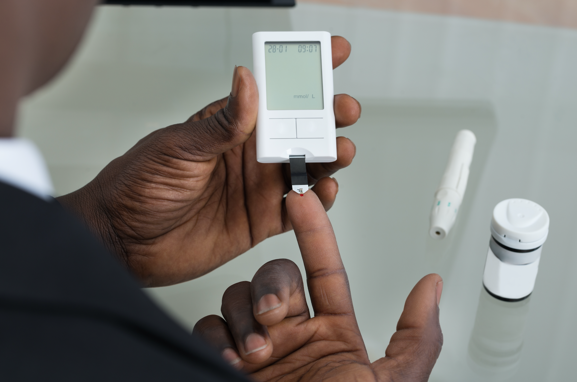 Patient measuring blood glucose