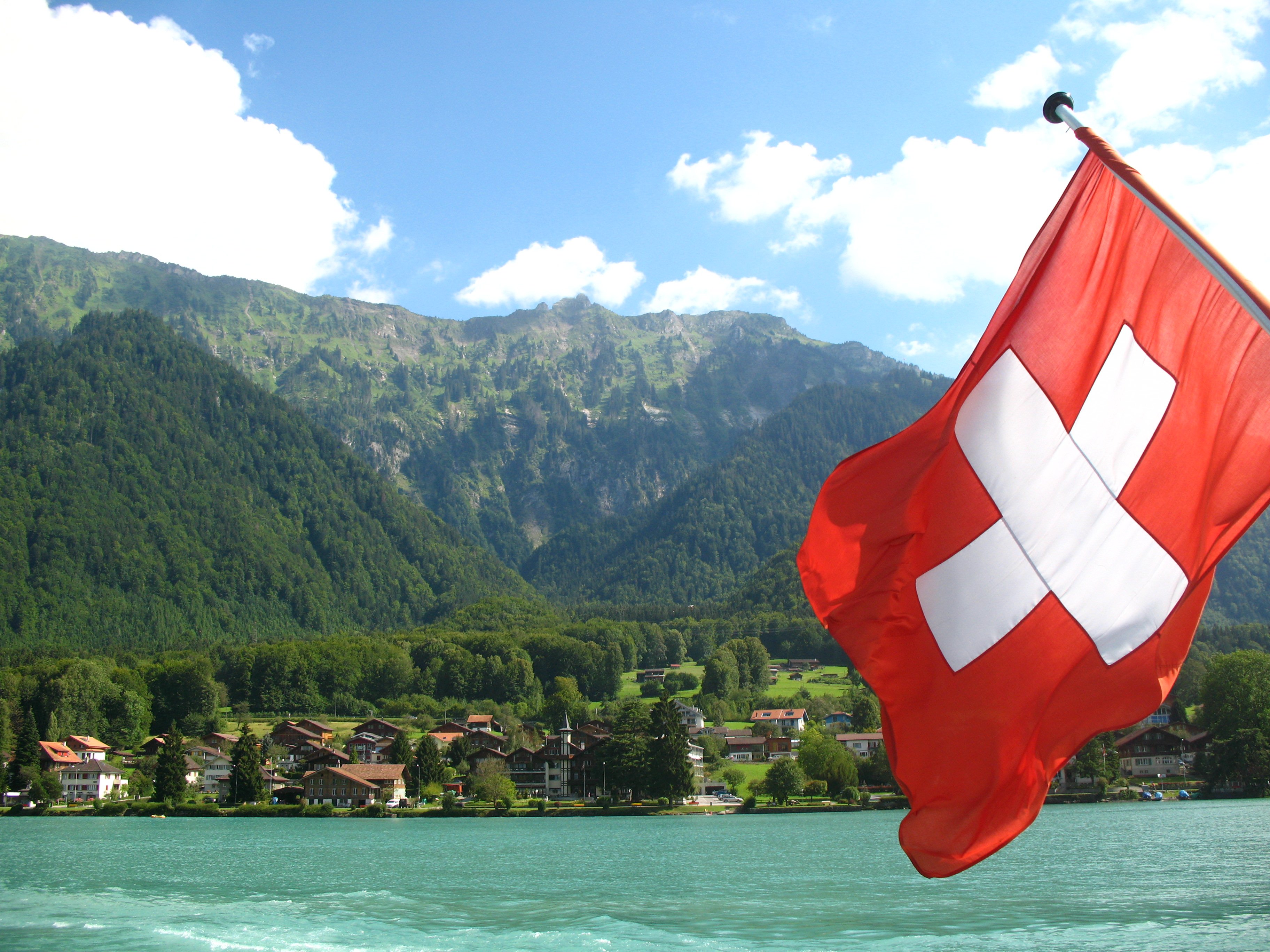 Swiss flag by a lake