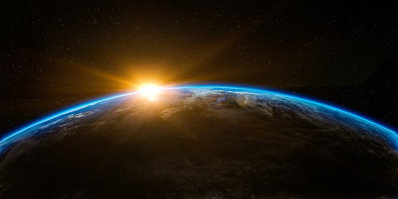 Illustration of sunrise over planet earth in space