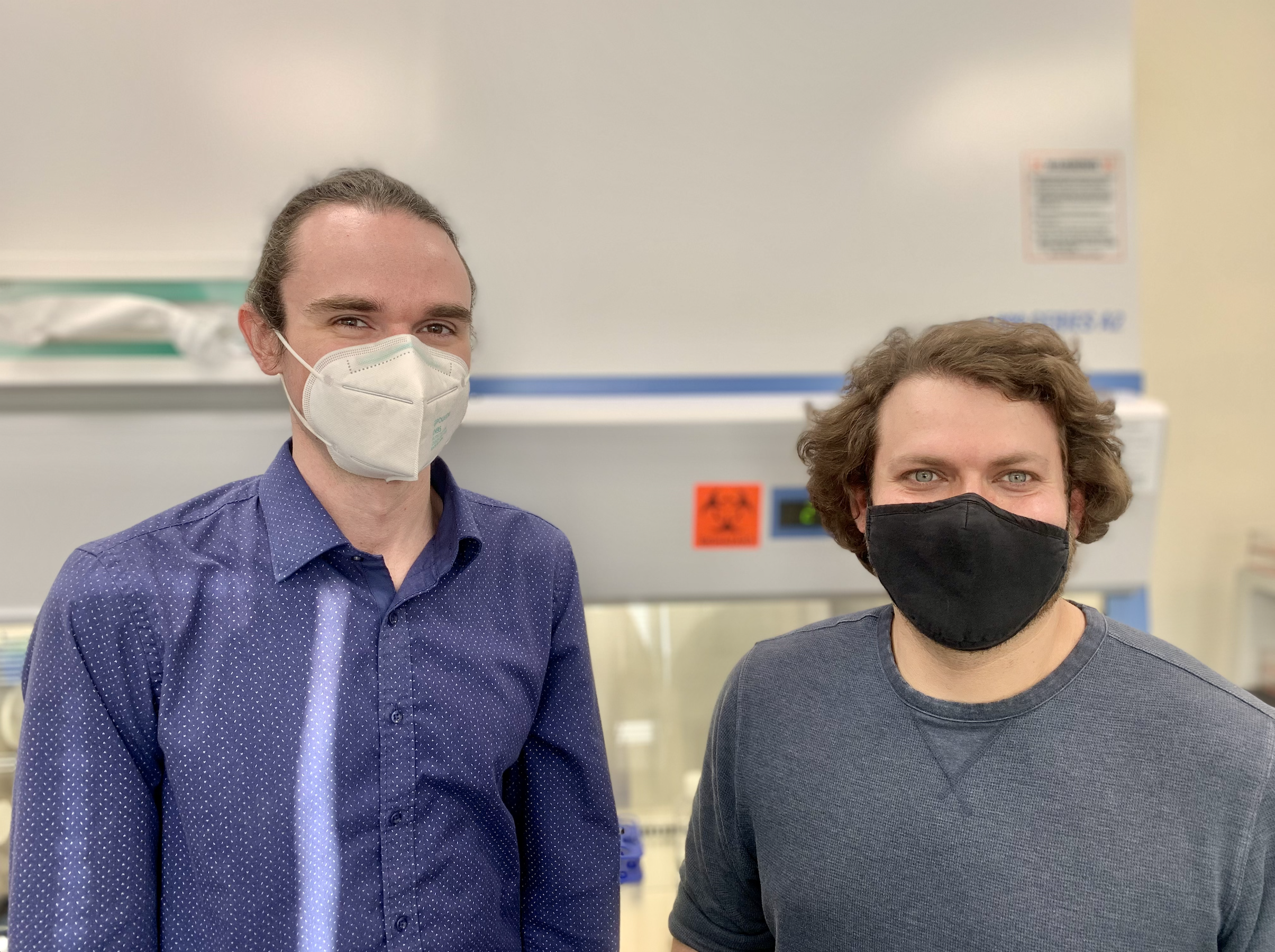 resistanceBio CEO Nick Goldner and COO Chris Bulow wearing masks in the lab