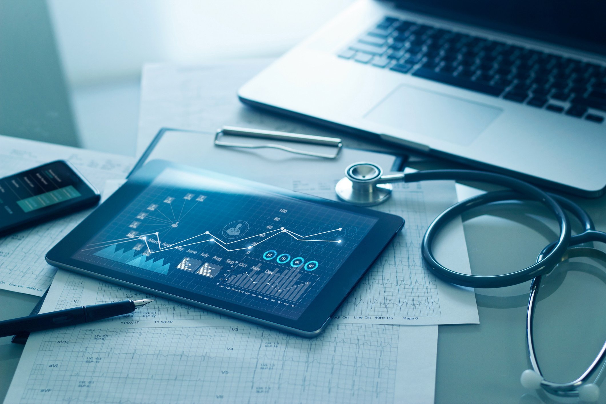 Medical examination and growth graph data of business on tablet with doctors health report clipboard on background 