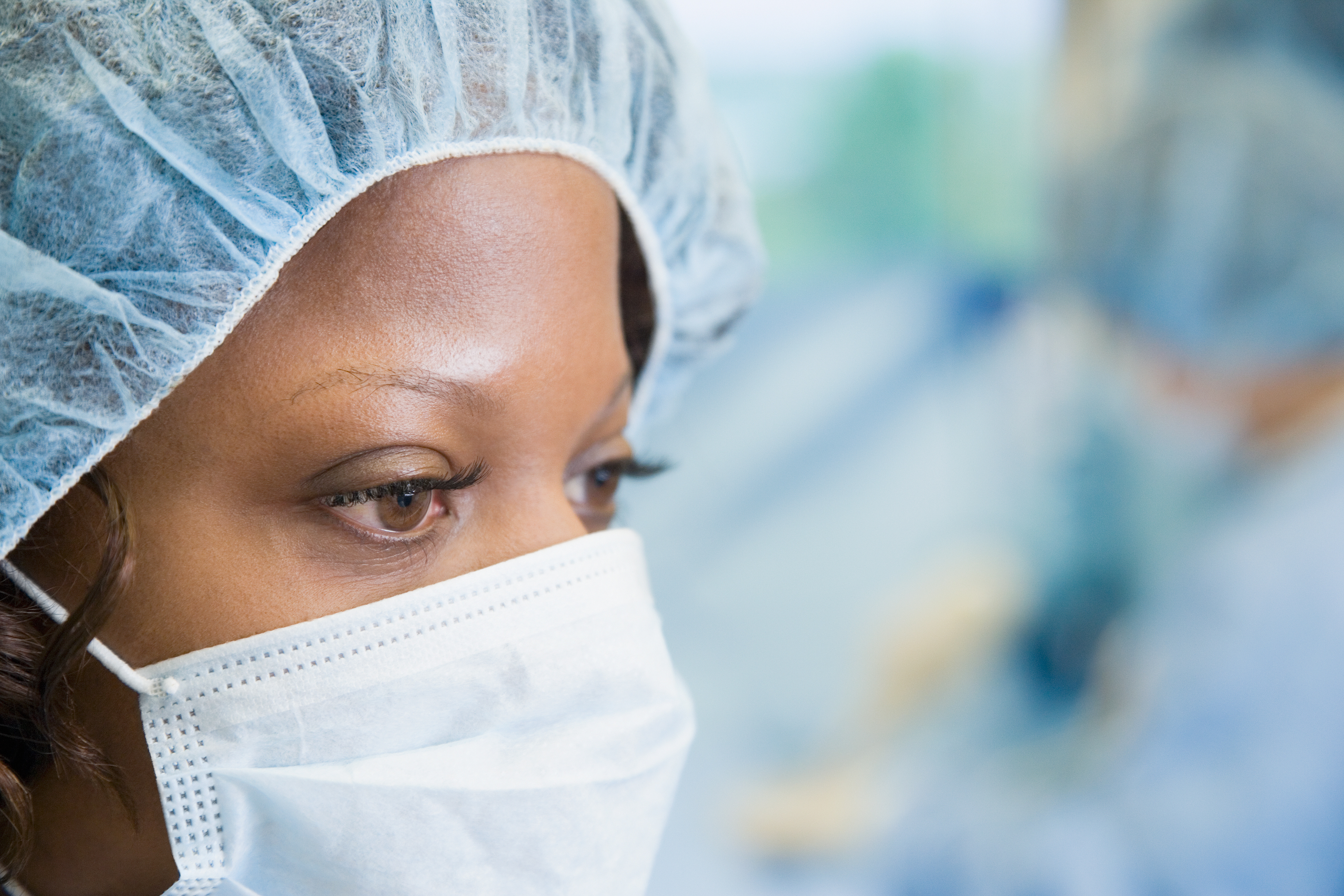 A surgeon focused on her work