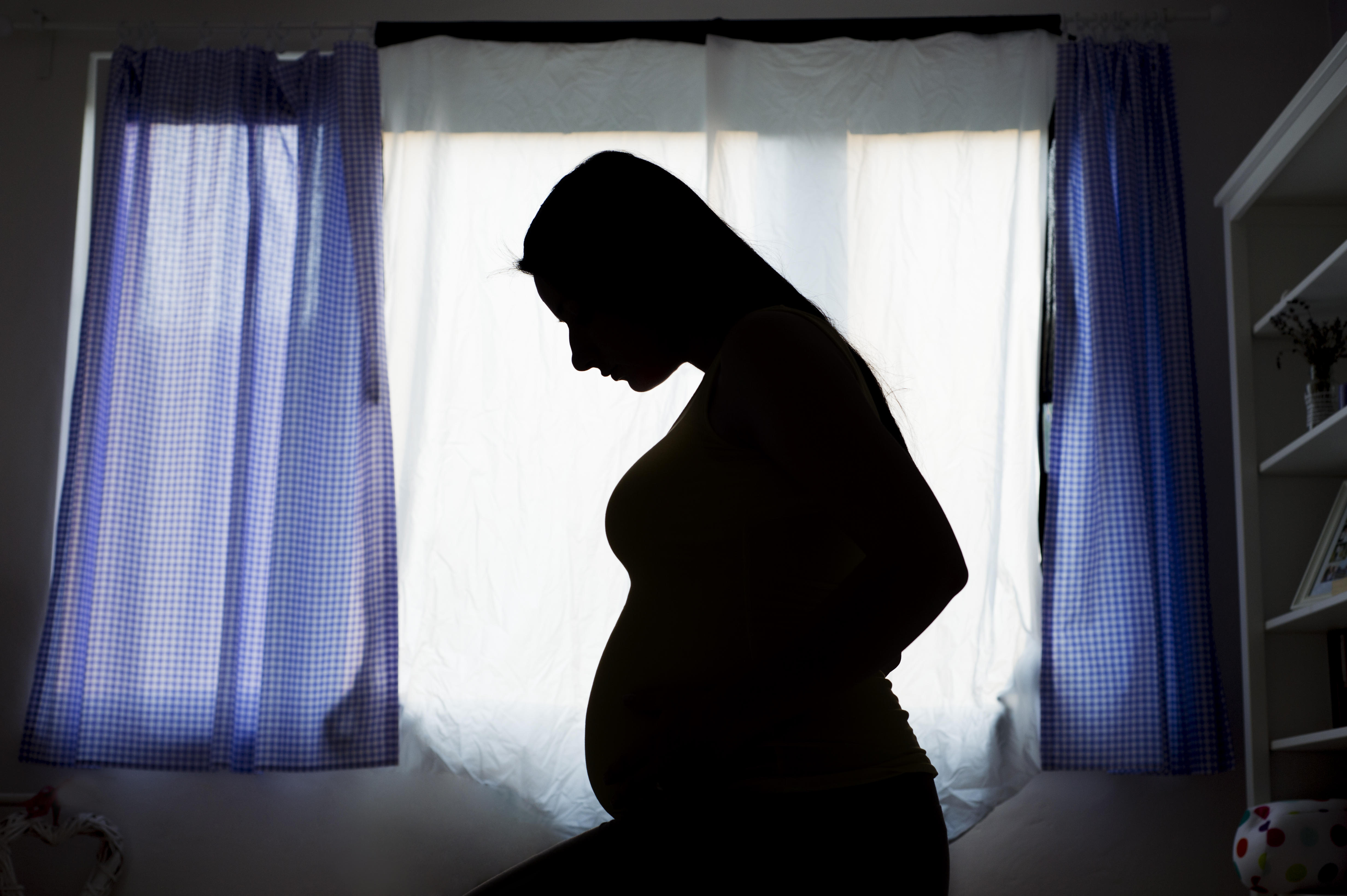 Pregnant woman in silhouette