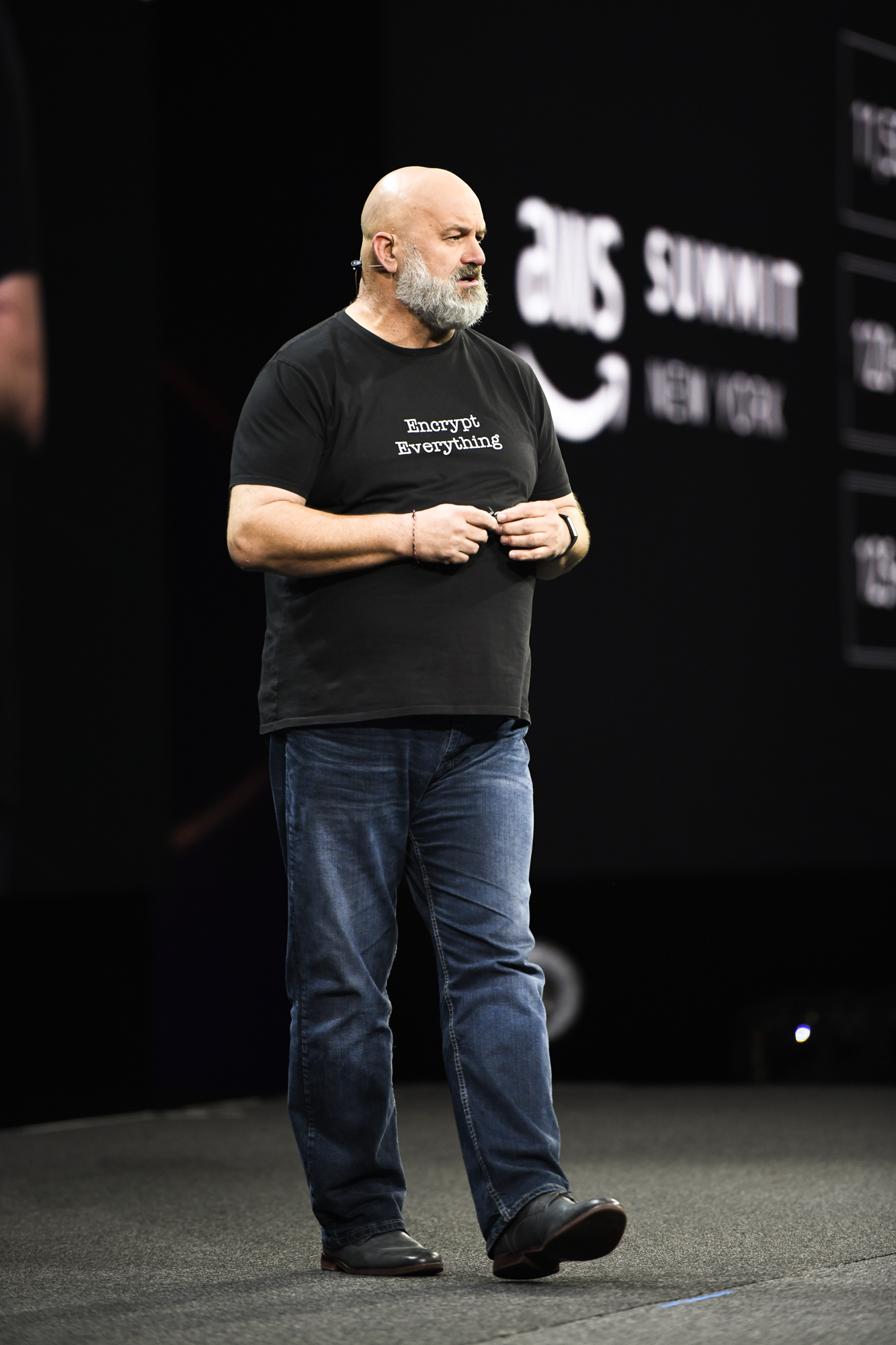 photo of Amazon CTO Werner Vogels on a stage giving a keynote speech