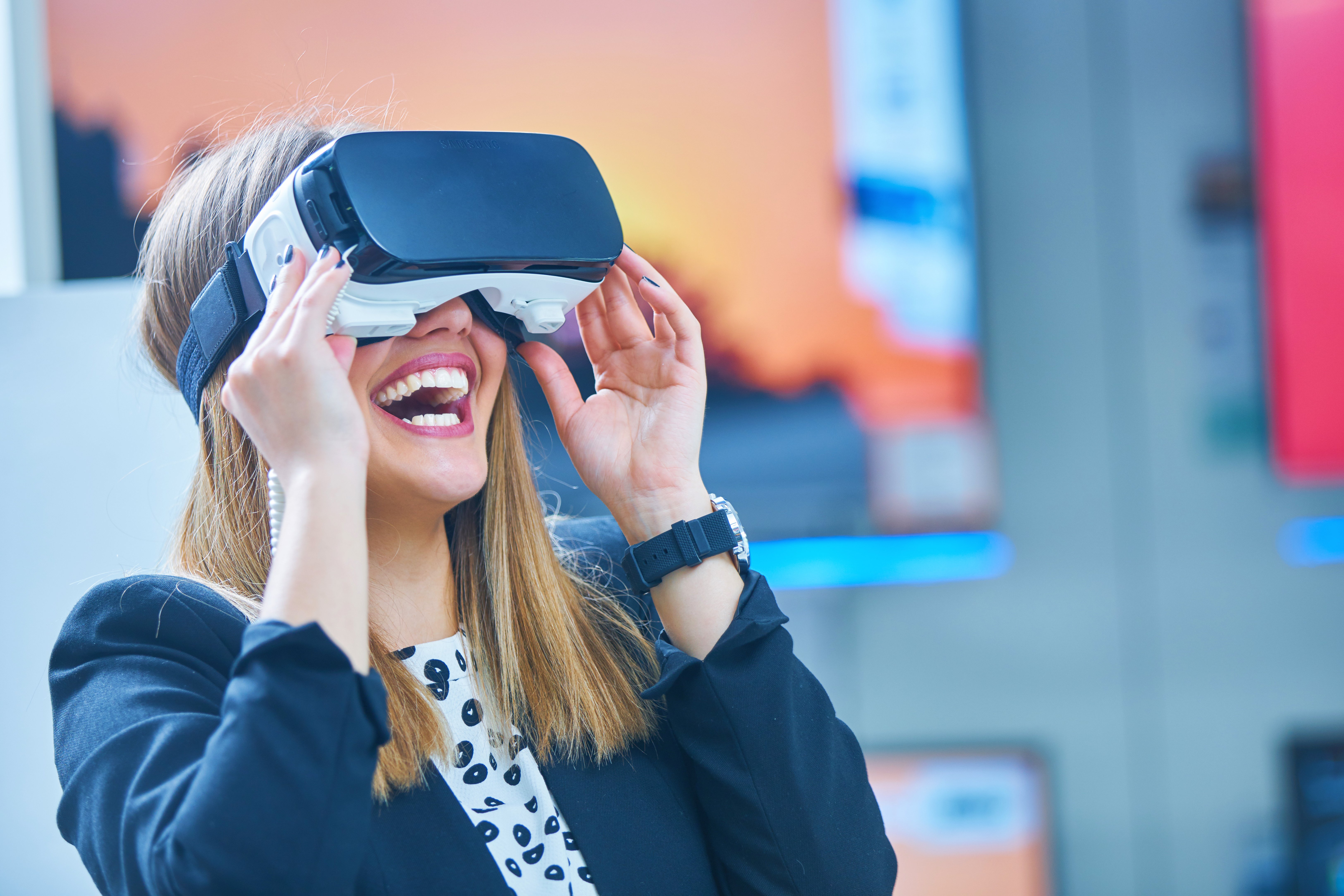 A young woman using a virtual reality headset