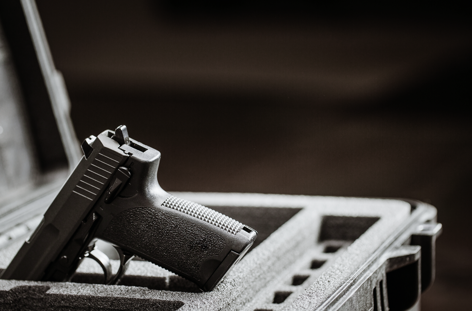 Image of a handgun in a safety case