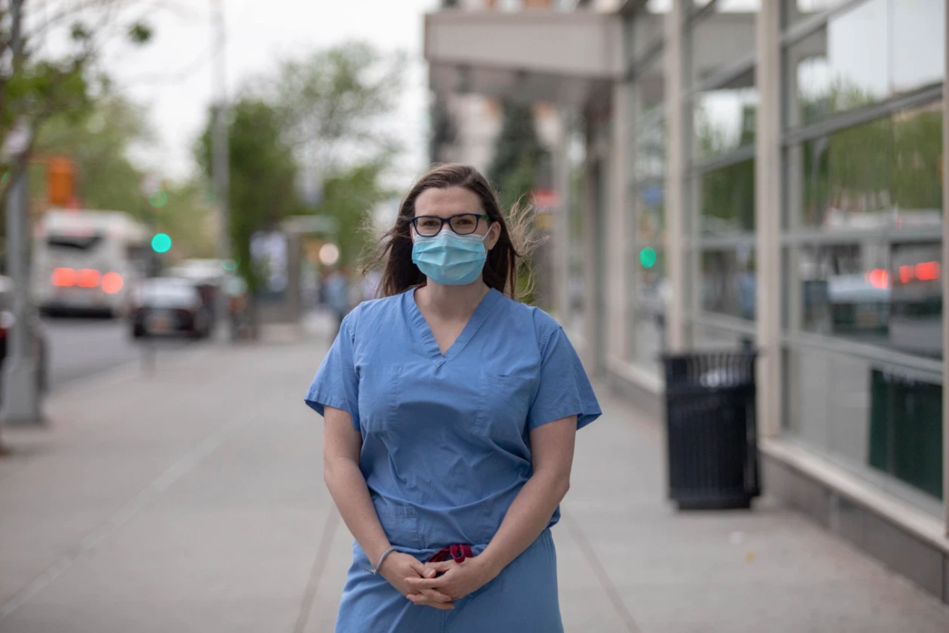 A female resident pictured with mask on outside the hospital