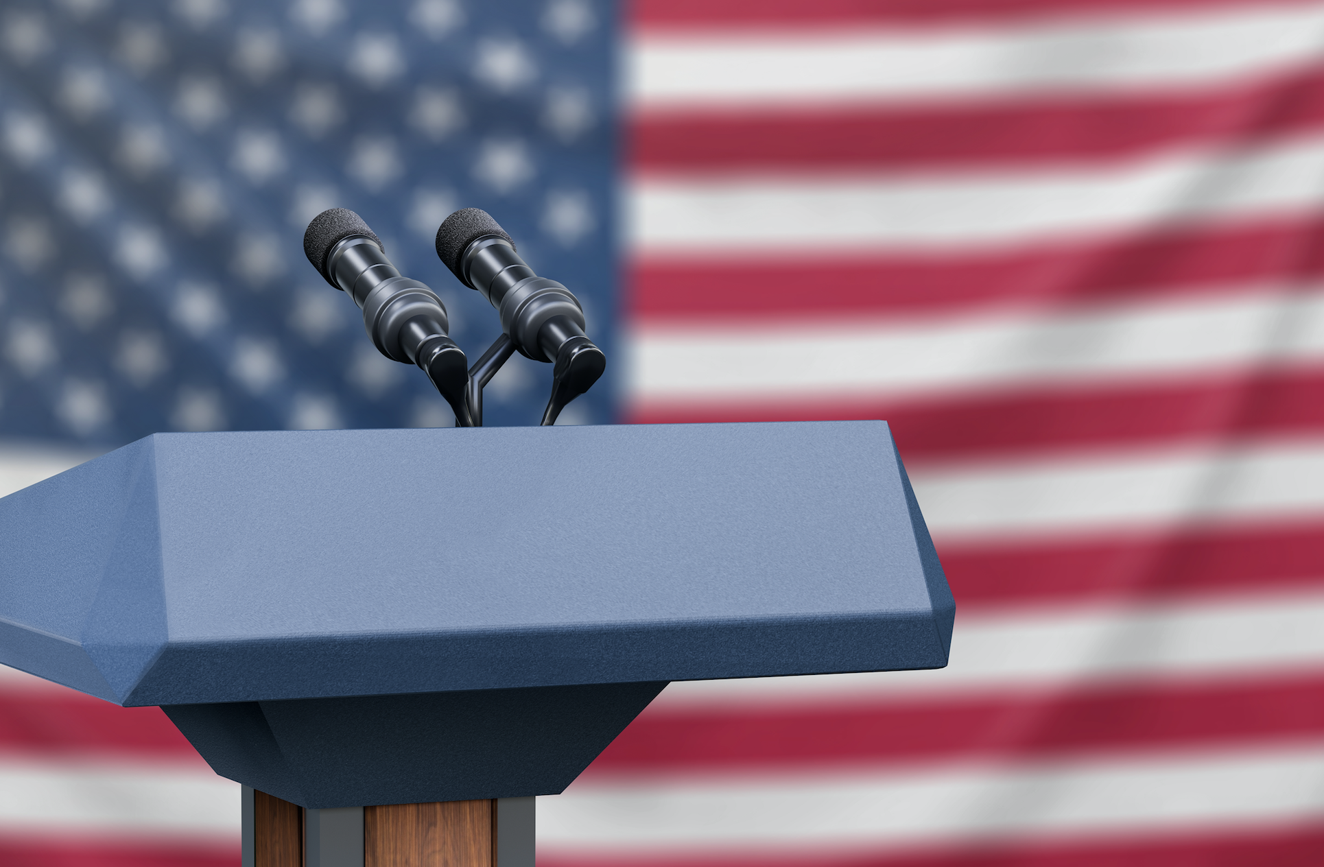 An empty debate podium in front of an American flag