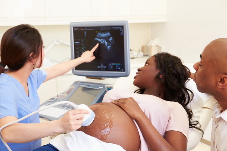 A pregnant woman receives an ultrasound