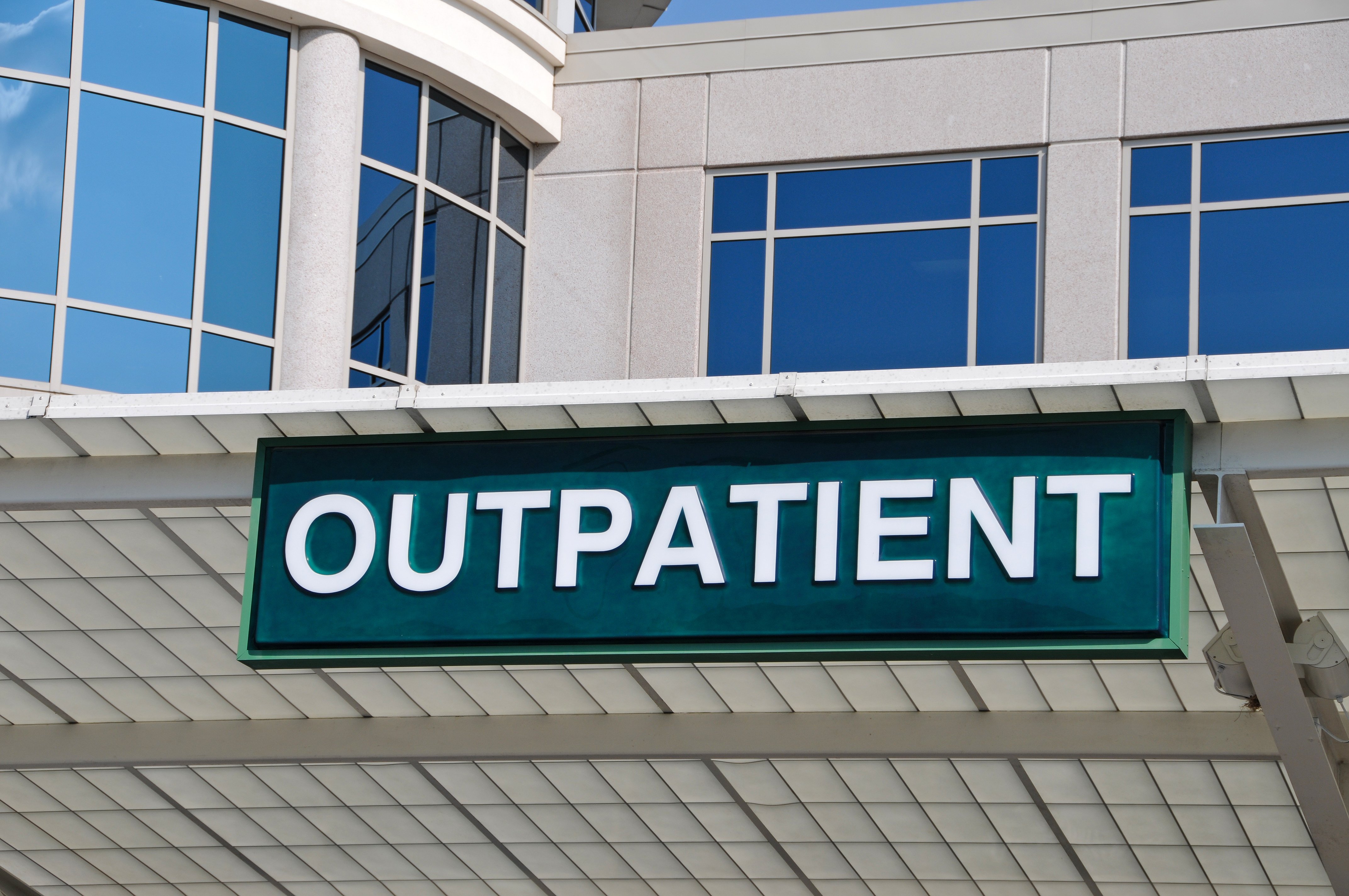 hospital building with a sign that says outpatient