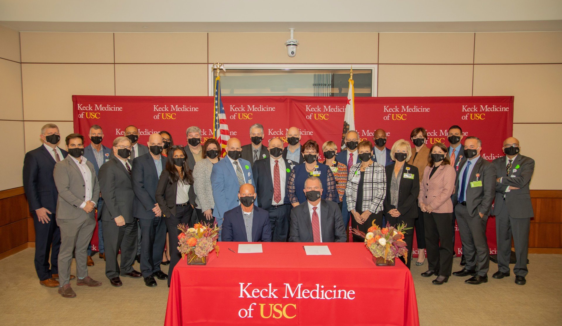 Leaders of Keck Medicine of USC and Methodist Hospital of Southern California in Arcadia gather after the two organizations s