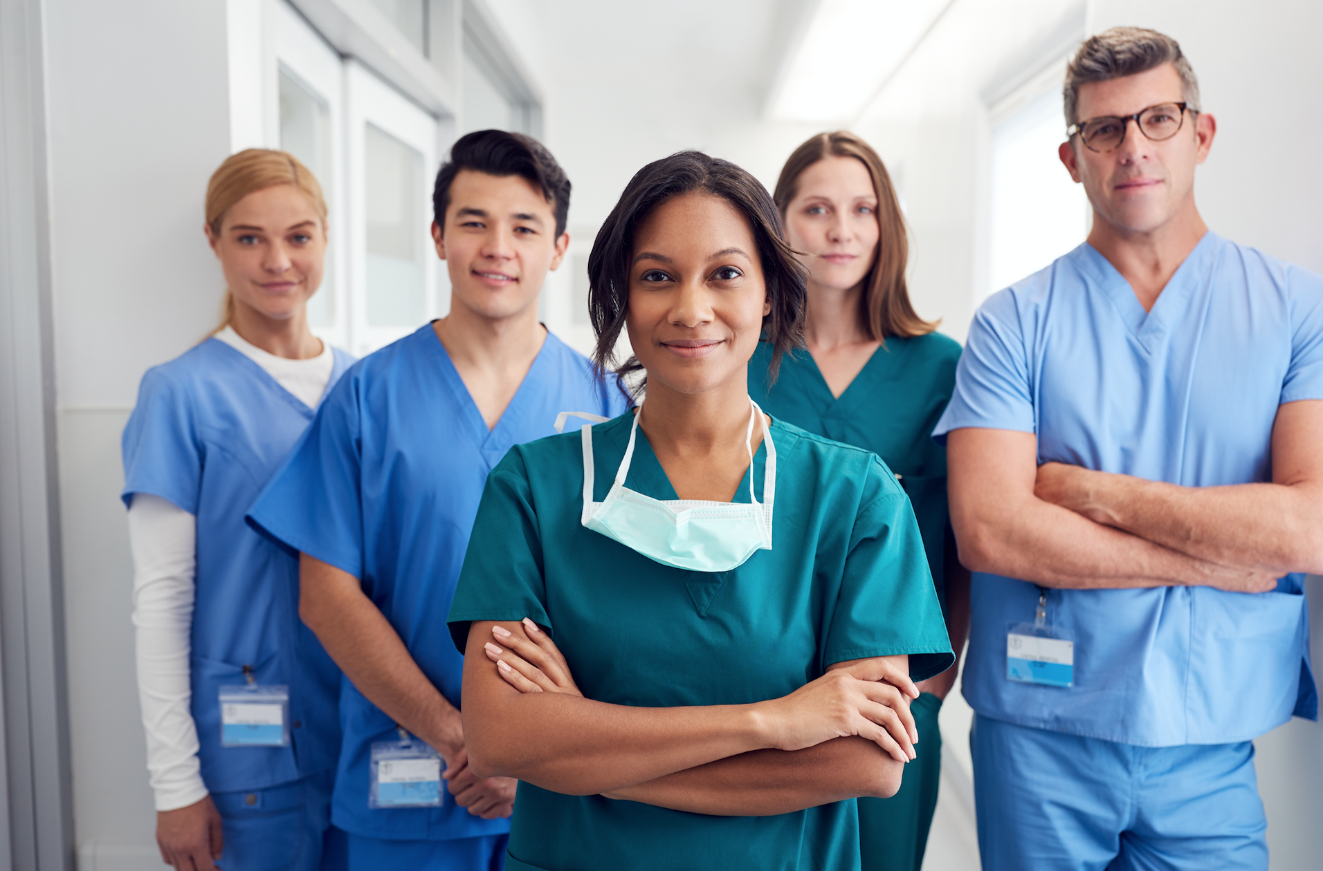 A group of nurses looks at the camera