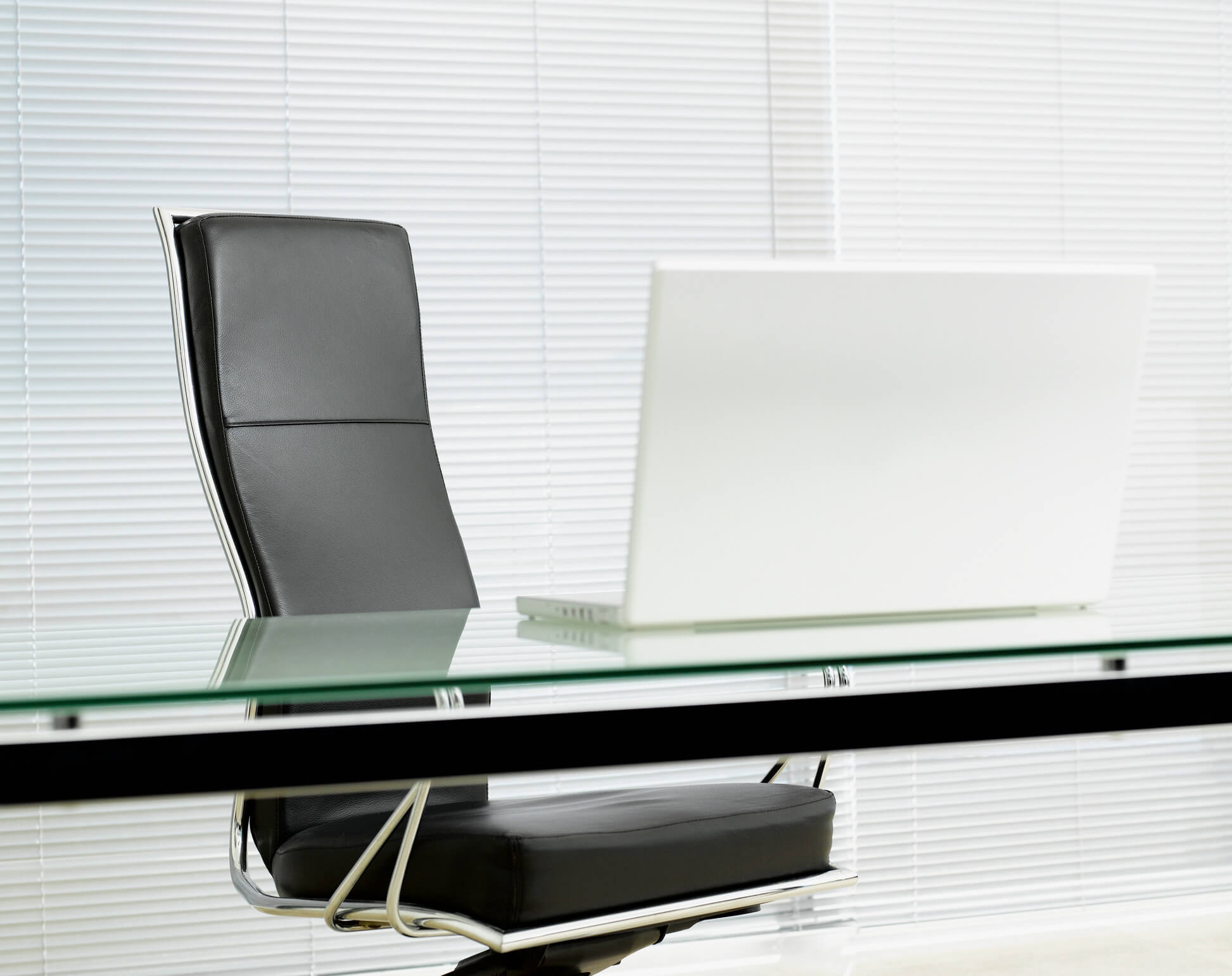 Empty desk chair in modern office
