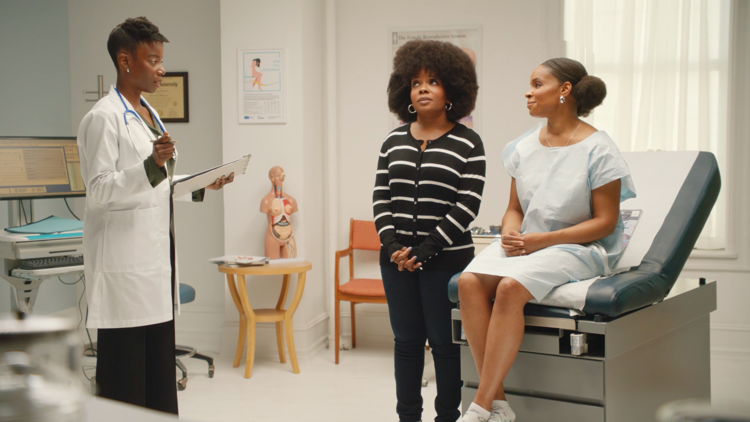 Amber Ruffin and her sister Lacey talk to a doctor in her office