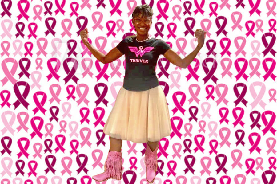 Photo of woman in front of a bunch of pink breast cancer ribbons