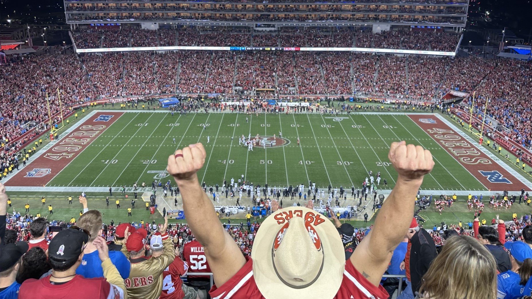 a 49ers fan lifts his fists in celebration during Sundays NFC Championship