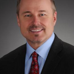 Photo of man in suit