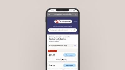 smartphone with screenshot of Walgreens Rx Savings Finder app