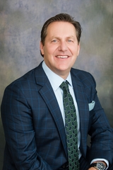 Photo of man in suit