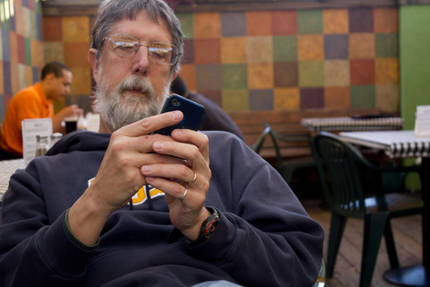 man looking at phone