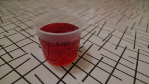 cough syrup cough syrup on geometric table cloth