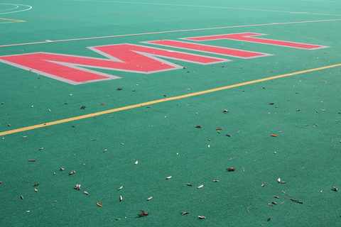 MIT written in the turf on a field