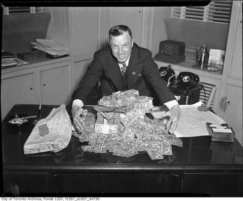 Man with pile of money