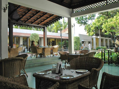 Tables set for a meal at an outdoor hotel restaurant