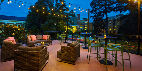 Outdoor patio with seating and lights